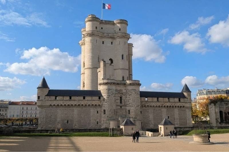The medieval donjon of Château de Vincennes with French flag flying